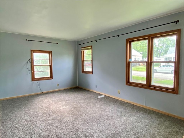 607 E Jefferson Ave, Casey, IL 62420 - spare room with carpet floors and baseboards