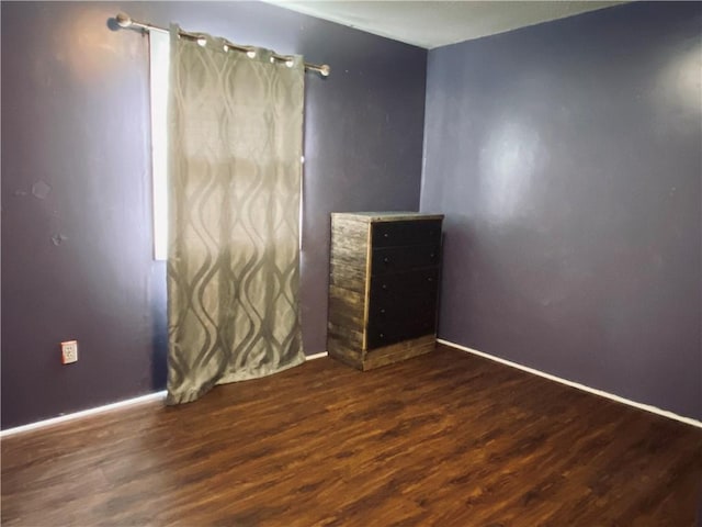 607 E Jefferson Ave, Casey, IL 62420 - empty room featuring wood finished floors and baseboards