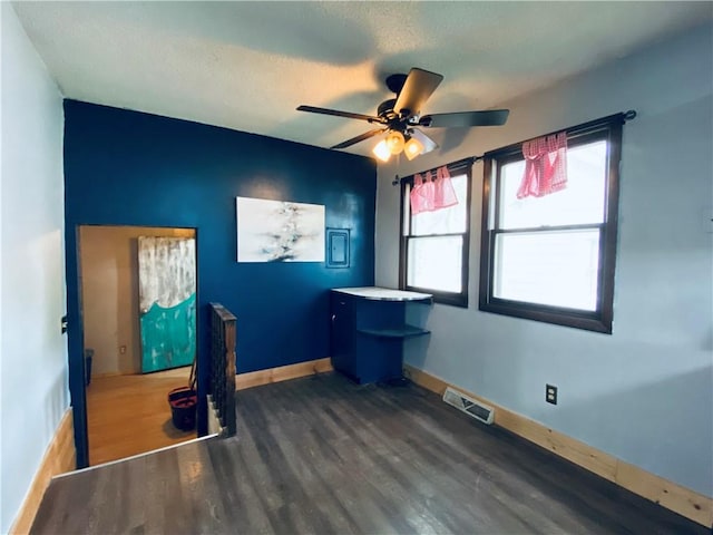 607 E Jefferson Ave, Casey, IL 62420 - unfurnished office with wood finished floors, a ceiling fan, baseboards, and a textured ceiling