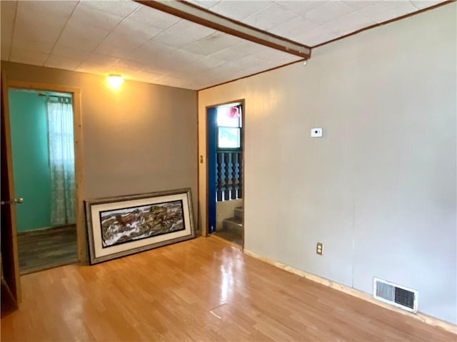 607 E Jefferson Ave, Casey, IL 62420 - unfurnished living room with wood finished floors and stairs