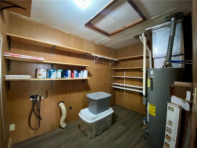 607 E Jefferson Ave, Casey, IL 62420 - basement with water heater, wood finished floors, and wood walls
