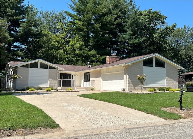 ranch-style home featuring a garage and a front lawn