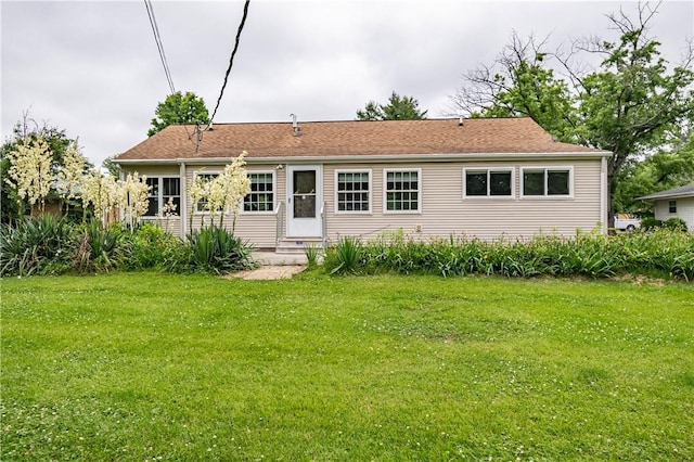 2008 Arthur Ave, Charleston, IL 61920 - rear view of house featuring entry steps and a lawn