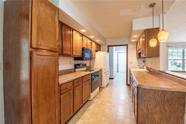 2008 Arthur Ave, Charleston, IL 61920 - kitchen featuring range with electric cooktop, black microwave, brown cabinets, freestanding refrigerator, and a textured ceiling