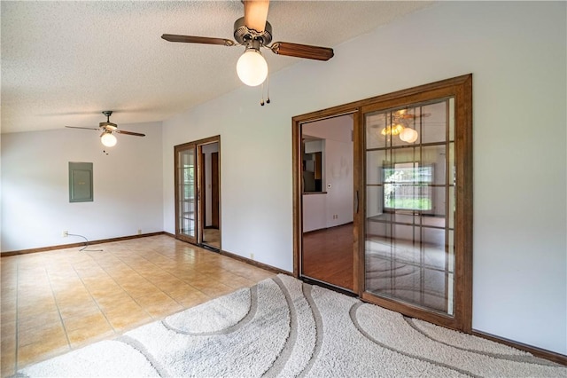 2008 Arthur Ave, Charleston, IL 61920 - spare room featuring electric panel, ceiling fan, a textured ceiling, tile patterned floors, and vaulted ceiling