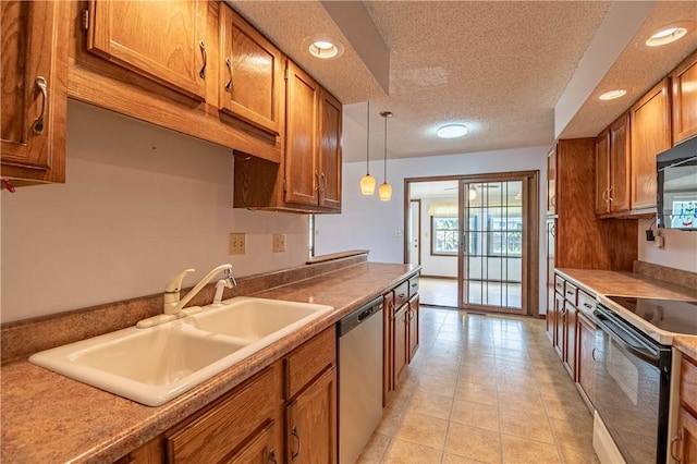2008 Arthur Ave, Charleston, IL 61920 - kitchen with black appliances, brown cabinetry, recessed lighting, a textured ceiling, and pendant lighting