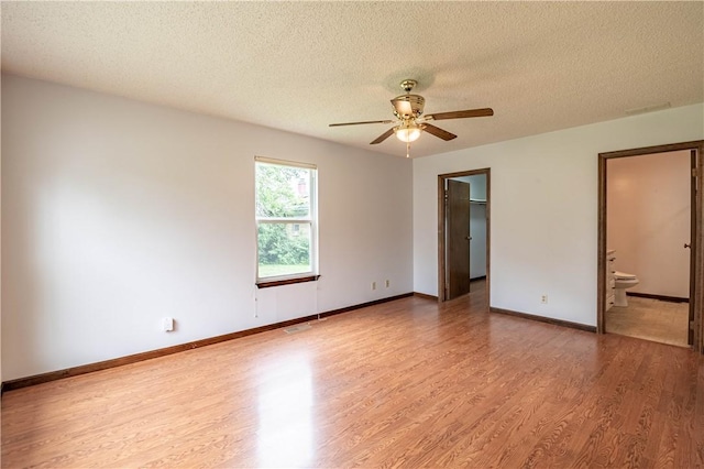 2008 Arthur Ave, Charleston, IL 61920 - spare room featuring wood finished floors, ceiling fan, and a textured ceiling