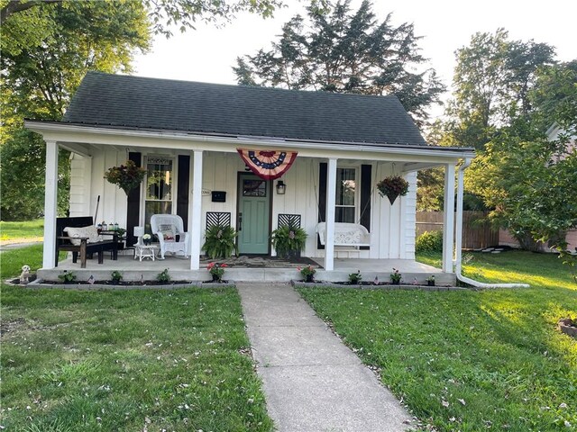 510 S 5th St, Marshall, IL 62441 - bungalow-style house with a porch, board and batten siding, and a shingled roof