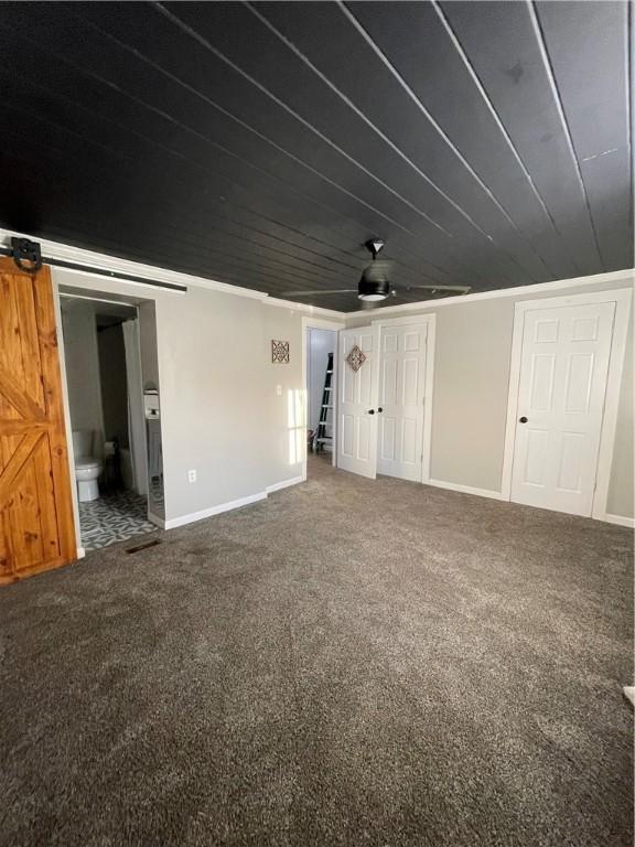 510 S 5th St, Marshall, IL 62441 - carpeted spare room with wooden ceiling and a barn door