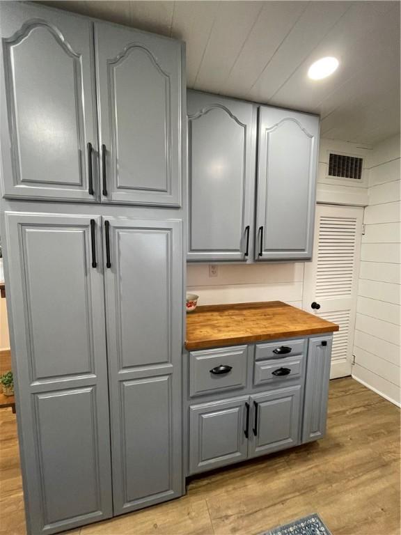 510 S 5th St, Marshall, IL 62441 - kitchen featuring gray cabinetry, wood counters, and light wood-style floors