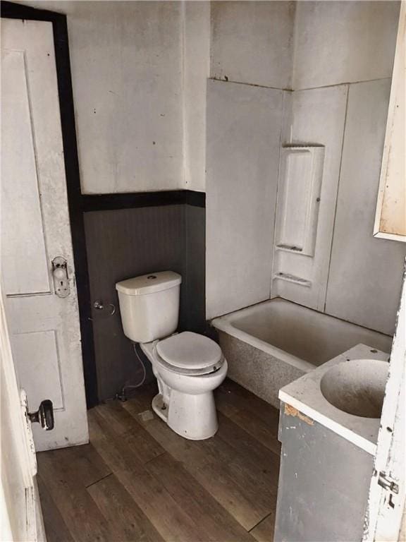 full bath with vanity, toilet, and wood finished floors