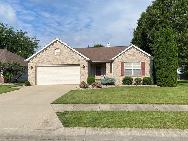 15 Fairfield Ln, Charleston, IL 61920 - ranch-style house featuring a front yard, concrete driveway, a garage, brick siding, and a shingled roof