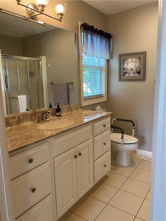 15 Fairfield Ln, Charleston, IL 61920 - full bathroom with tile patterned flooring, vanity, toilet, a shower stall, and baseboards