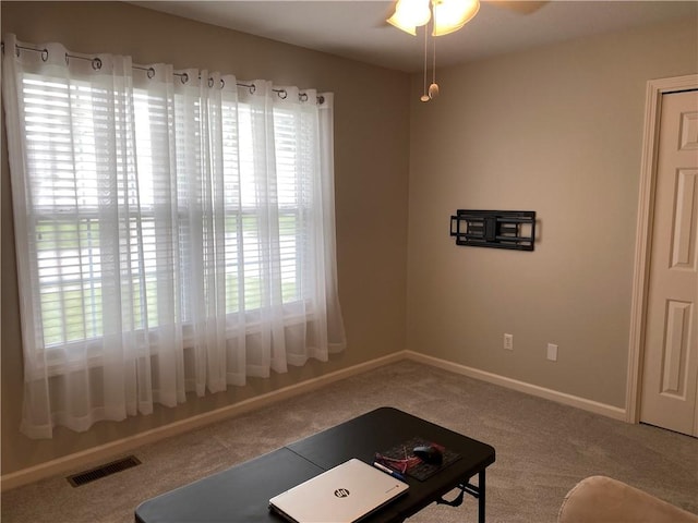 15 Fairfield Ln, Charleston, IL 61920 - carpeted living area with ceiling fan and baseboards