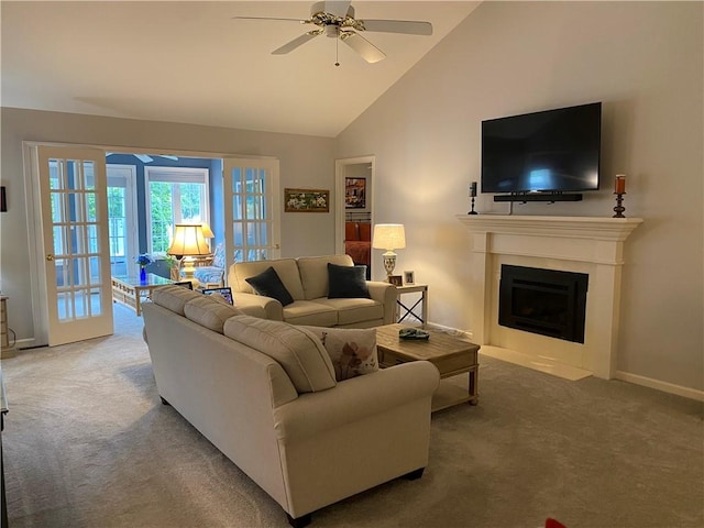 15 Fairfield Ln, Charleston, IL 61920 - carpeted living room with ceiling fan, a fireplace with flush hearth, baseboards, and high vaulted ceiling