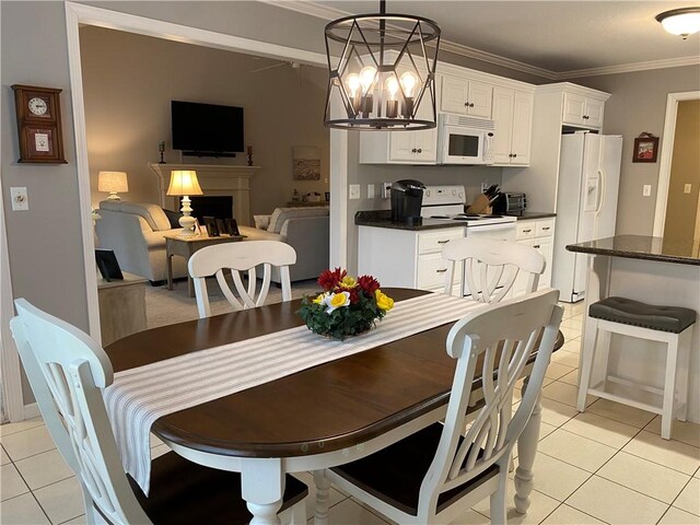 15 Fairfield Ln, Charleston, IL 61920 - dining room featuring light tile patterned floors, crown molding, a fireplace, and a chandelier