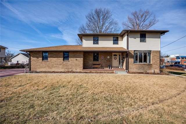 view of front of house featuring a porch and a front lawn