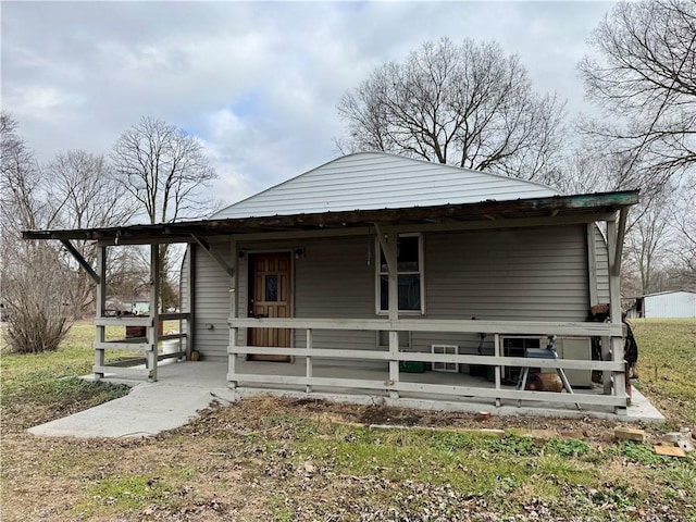 back of house with covered porch