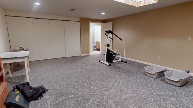 exercise area featuring carpet flooring