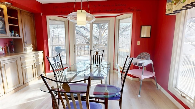 dining area with light wood-type flooring