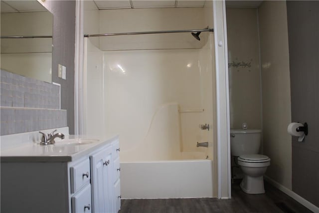 full bathroom featuring shower / tub combination, wood-type flooring, vanity, and toilet