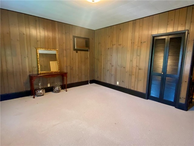 401 E Fourth St, Pana, IL 62557 - unfurnished bedroom with carpet flooring, wooden walls, and baseboards