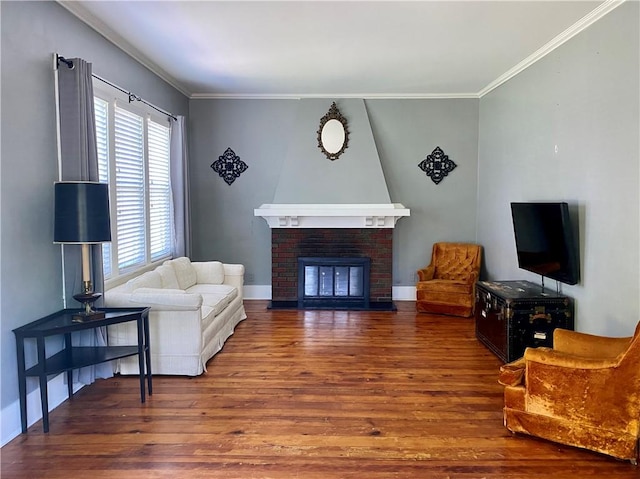 401 E Fourth St, Pana, IL 62557 - living area with wood finished floors, crown molding, baseboards, and a fireplace