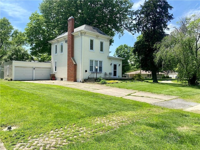 401 E Fourth St, Pana, IL 62557 - italianate house with a chimney, a front lawn, and an outbuilding