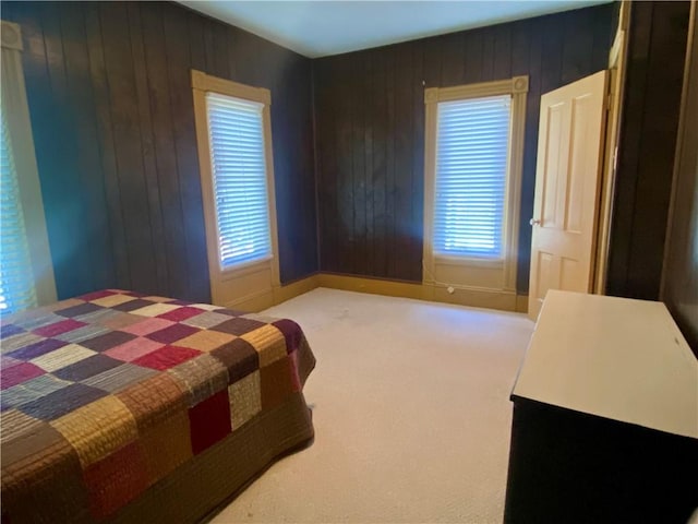 401 E Fourth St, Pana, IL 62557 - carpeted bedroom with wood walls