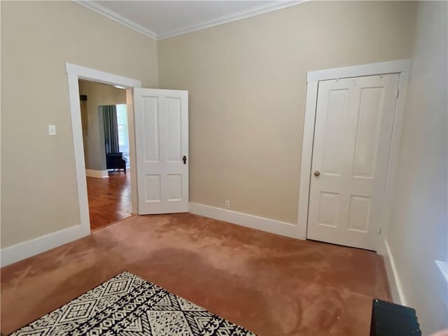 401 E Fourth St, Pana, IL 62557 - unfurnished bedroom featuring light colored carpet, crown molding, and baseboards