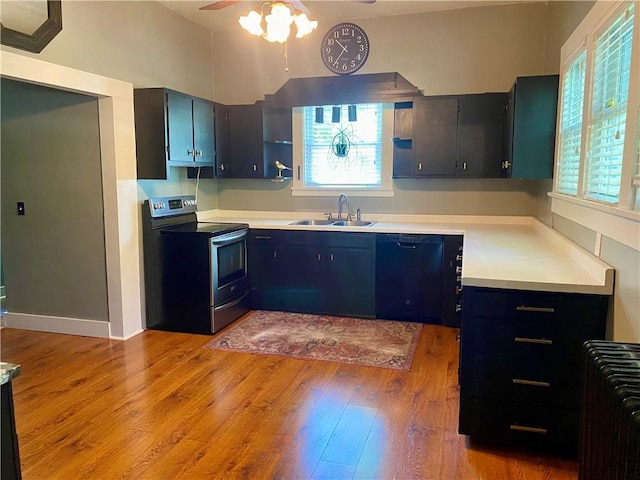 401 E Fourth St, Pana, IL 62557 - kitchen with stainless steel range with electric stovetop, a sink, dishwasher, a ceiling fan, and plenty of natural light