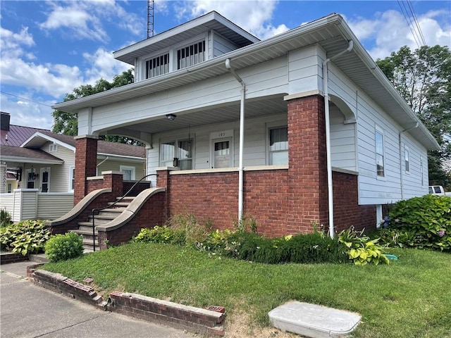 105 S Lafayette St, Newton, IL 62448 - view of front of home with brick siding and covered porch
