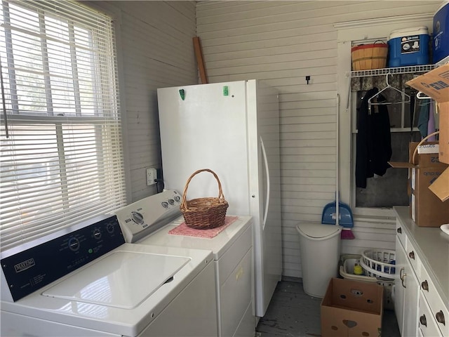 105 S Lafayette St, Newton, IL 62448 - washroom featuring washing machine and clothes dryer, wood walls, and cabinet space