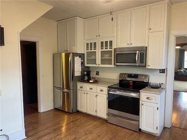105 S Lafayette St, Newton, IL 62448 - kitchen with appliances with stainless steel finishes, dark wood finished floors, and light countertops