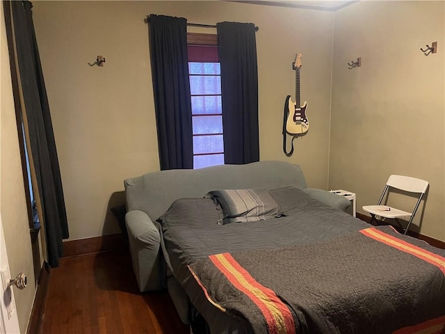 105 S Lafayette St, Newton, IL 62448 - bedroom featuring wood finished floors and baseboards