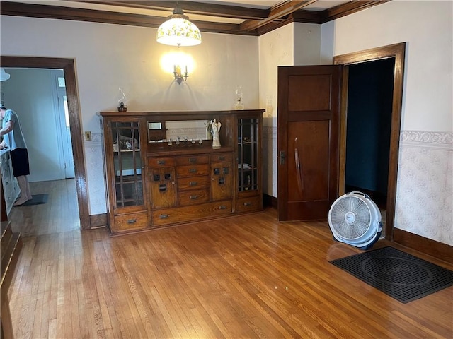 105 S Lafayette St, Newton, IL 62448 - dining room featuring wood-type flooring, ornamental molding, and beam ceiling