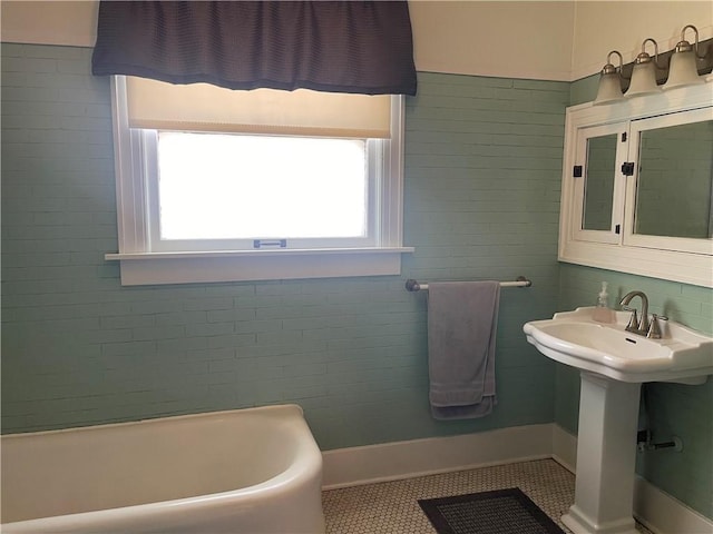 105 S Lafayette St, Newton, IL 62448 - full bath featuring a tub and tile patterned floors