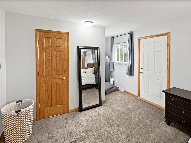 bedroom with carpet and baseboards