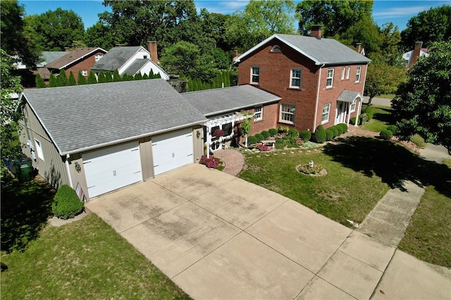 view of front of home featuring a garage and a front yard