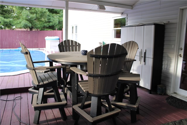 wooden terrace featuring a covered pool