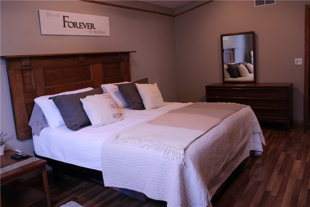 bedroom featuring dark hardwood / wood-style floors