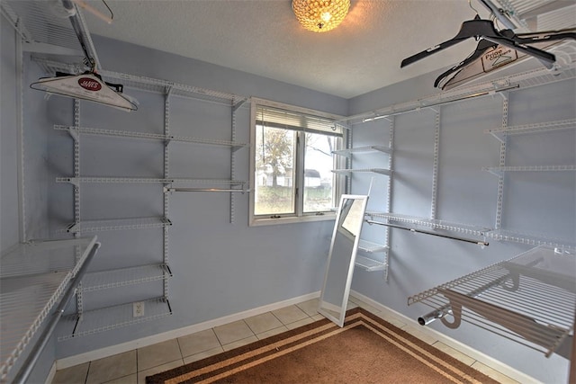 spacious closet with tile patterned flooring