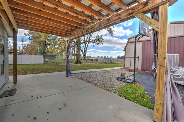 view of patio / terrace with basketball hoop