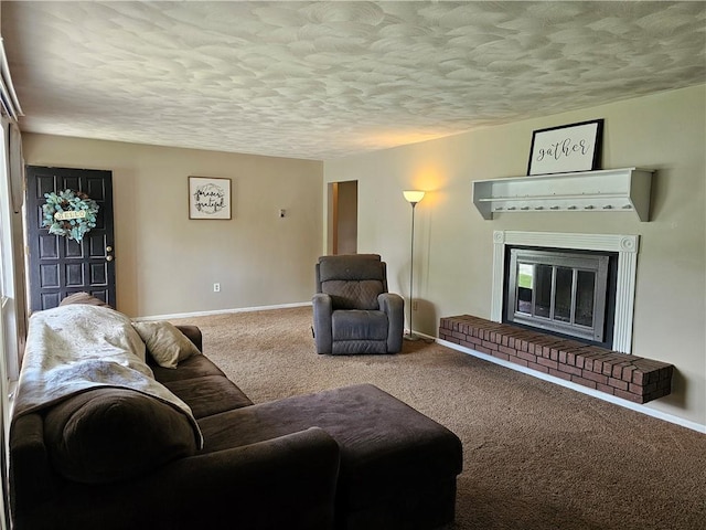 201 N Indiana St, Toledo, IL 62468 - living room featuring a textured ceiling, carpet flooring, baseboards, and a brick fireplace