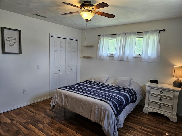 201 N Indiana St, Toledo, IL 62468 - bedroom with wood finished floors, a closet, a ceiling fan, and baseboards