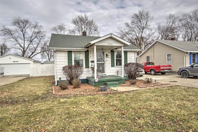 bungalow-style house with a garage, a chimney, a front yard, and fence