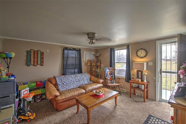 living area featuring carpet flooring and ornamental molding