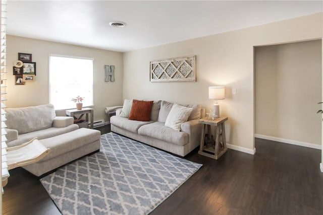 living room with dark wood-style floors, a baseboard heating unit, visible vents, and baseboards