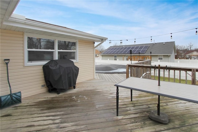 wooden terrace featuring fence and area for grilling