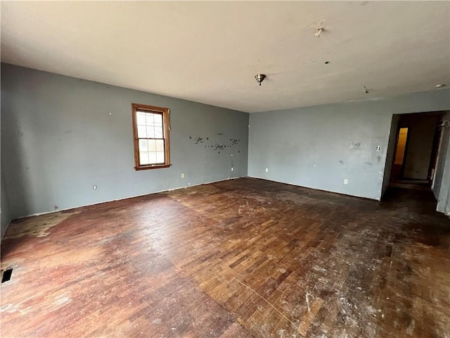 spare room with dark hardwood / wood-style floors